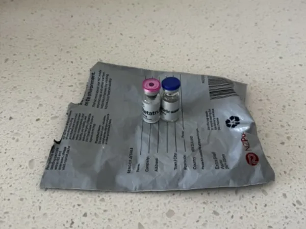 Customer photo: Two vials on the NZ Post bag, as received